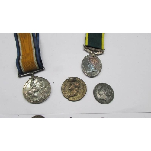 238 - A small collection of medals and coins etc., Including WW1 medal.