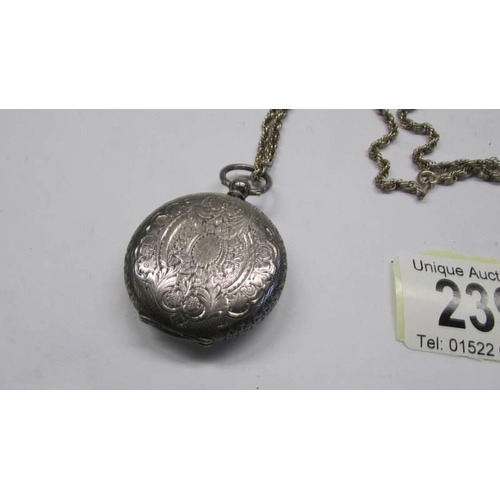 239 - A ladies silver fob watch on silver chain.