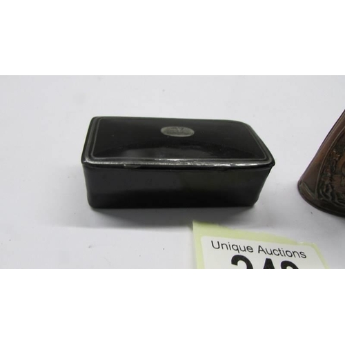 243 - A lacquered snuff box and a match holder with striker.