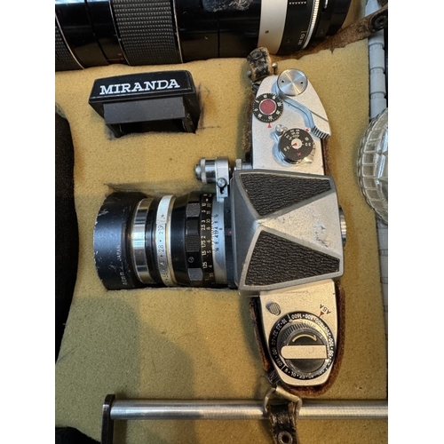 443 - A silver coloured case of cameras & accessories including Miranda no 668252 with Lens, Miranda No 65... 