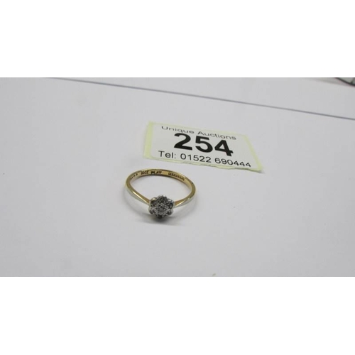 254 - Two 18ct gold and gold/platinum rings, both size L half, 4.5 grams.