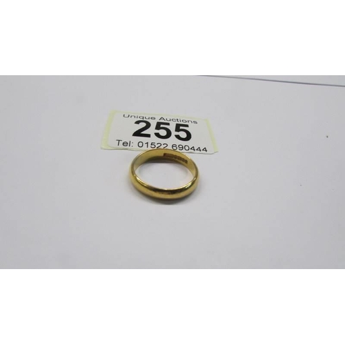 255 - A 22ct gold wedding band, size P, 5.05 grams.