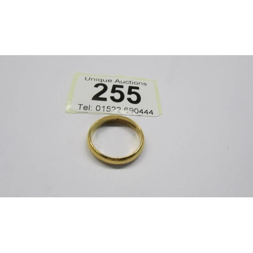 255 - A 22ct gold wedding band, size P, 5.05 grams.