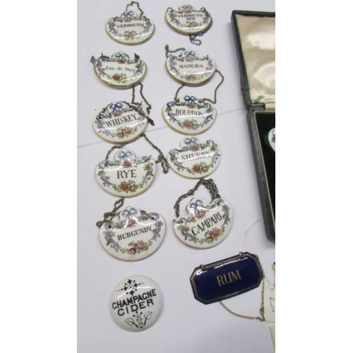 263 - A quantity of ceramic decanter labels including four in a case.