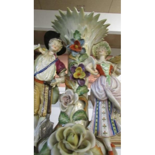 267 - A 19th century porcelain vase supported by male and female figures (needs a good clean).