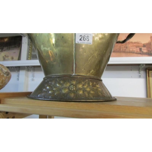 268 - A good old brass helmet shaped coal scuttle.