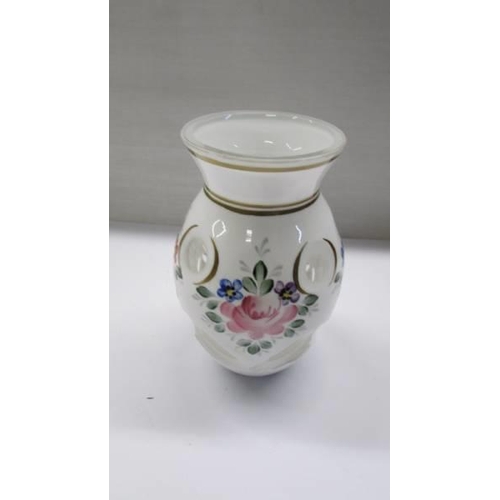 275 - A pretty floral decorated overlaid glass vase.