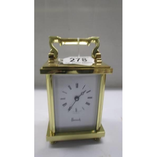 278 - A good brass carriage clock from Harrods in working order.