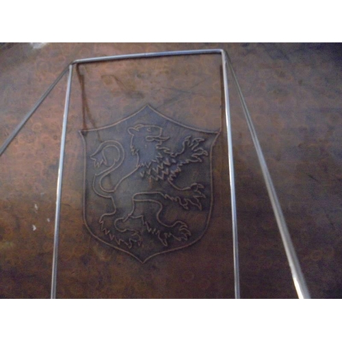 285 - A large oval copper tray with impressed coat of arms.