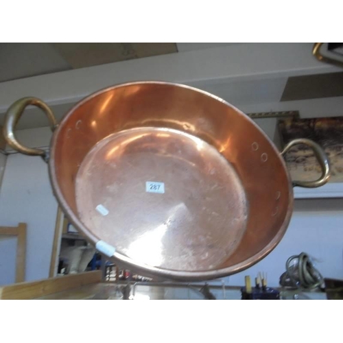 287 - A large copper pan.