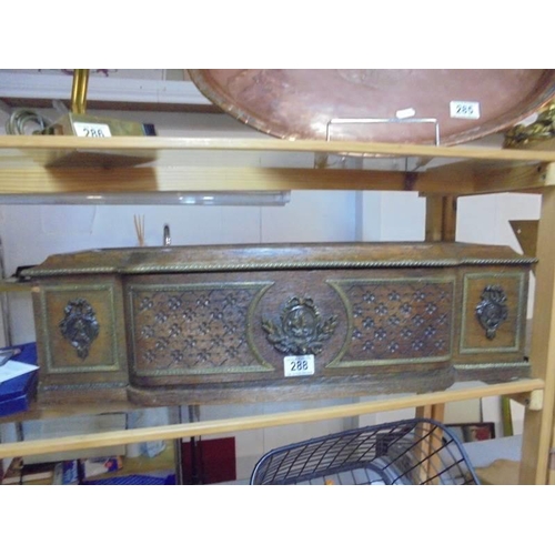 288 - An unusual wide oak box with decorative metal plaques.