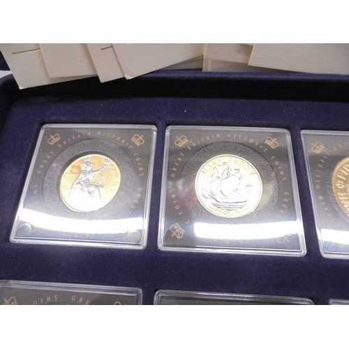 290 - Eleven gold plated commemorative coins with certificates in a case.