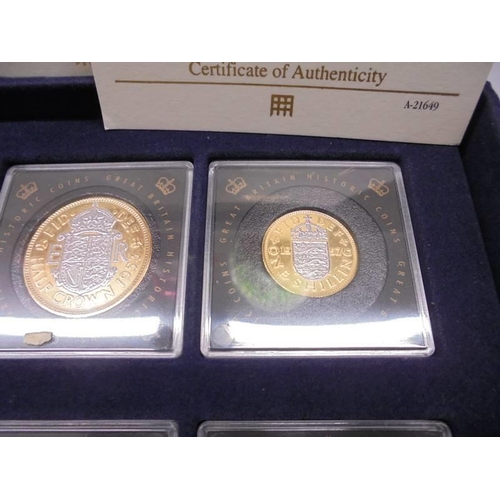 290 - Eleven gold plated commemorative coins with certificates in a case.