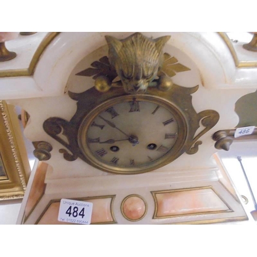 484 - A 19th century alabaster clock, in working order.