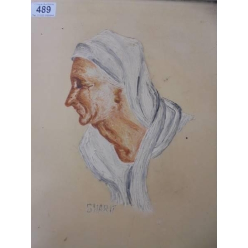 489 - A portrait of an elderly lady signed Sharif. 42 x 32 cm.