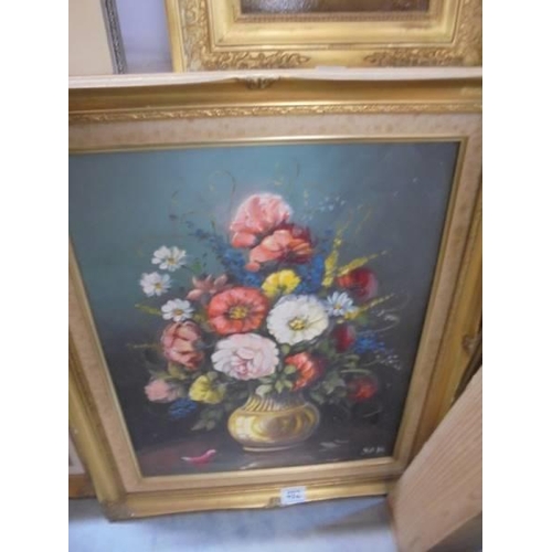 492 - A gilt framed oil on canvas floral display initialed S A H, image 49 x 39 cm, frame 52 x 62 cm.