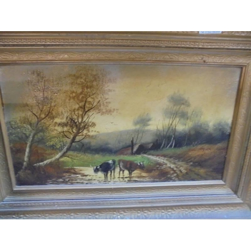 503 - A pair of gilt framed oil on canvas rural scene with cattle, image 44 x 23 cm, frame 63 x 43 cm.