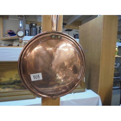 505 - A Victorian copper warming pan.