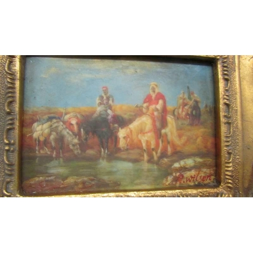 519 - A gilt framed Arabian scene,