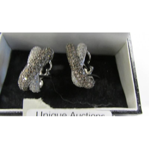 100S - A pair of Pave' set diamond earrings in a twist design, white/cognac diamonds, clip & post fitting s... 