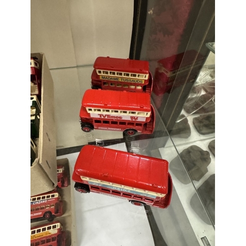 533 - 2 shelves of die cast model buses