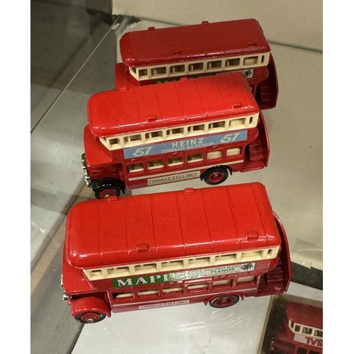 533 - 2 shelves of die cast model buses