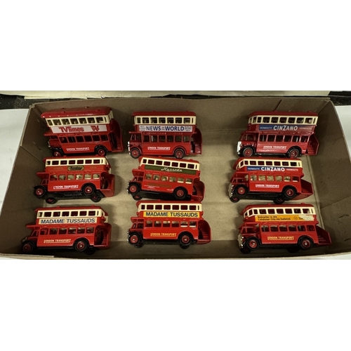 533 - 2 shelves of die cast model buses