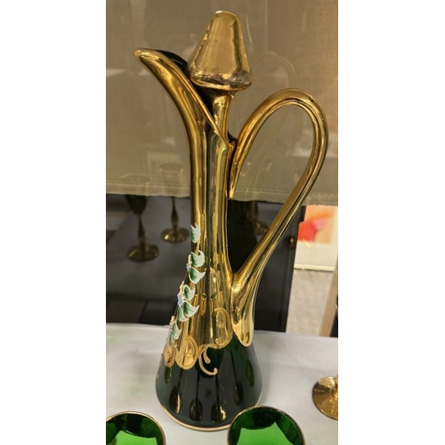 549 - A green glass & gilt decanter with 6 glasses