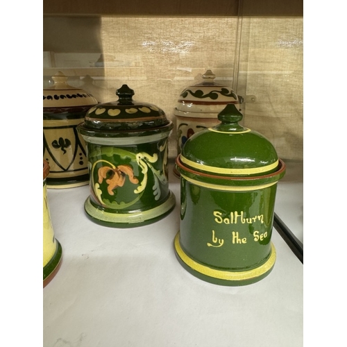 566 - 8 Torquay ware tobacco & preserve jars