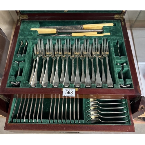 568 - An Edwardian mahogany cased canteen of cutlery