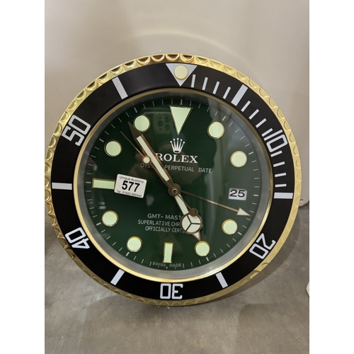 577 - A wall clock in the style of a Rolex watch