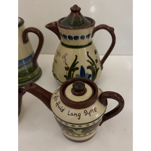 592 - A quantity of vintage Torquay ware tea & coffee pots