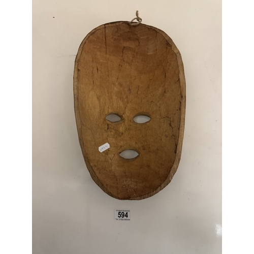 594 - A carved wood tribal mask