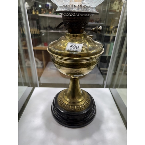 599 - A Victorian brass oil lamp