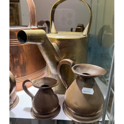 614 - A quantity of copper measuring jugs & 2 watering cans