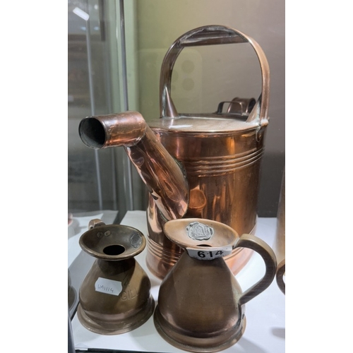 614 - A quantity of copper measuring jugs & 2 watering cans