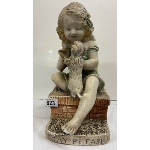 623 - A vintage chalkware figure of a seated girl. Reg no 765573 LMC 47G