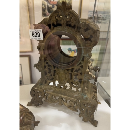 629 - A Victorian brass ormolu clock case