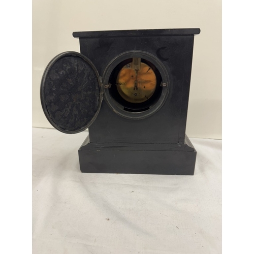 630 - A Victorian black slate mantle clock