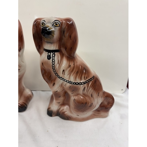 638 - A pair of vintage Staffordshire dogs