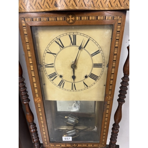 657 - A good inlaid wall clock in working order, needs a key, no door catch