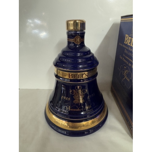 667 - A boxed Bells extra special old Scotch whiskey decanter 'The Prince of Wales 50th birthday'