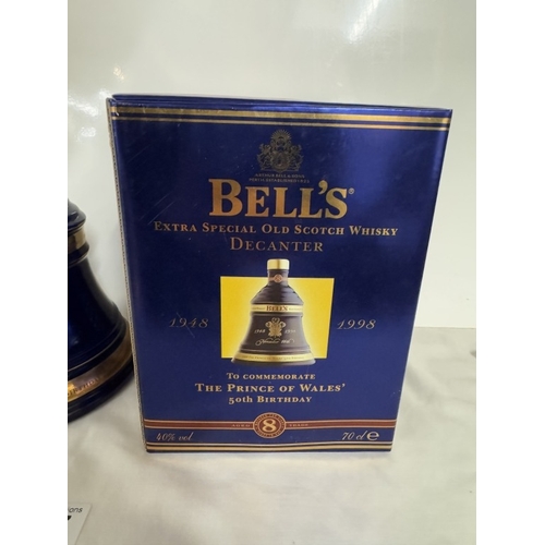 667 - A boxed Bells extra special old Scotch whiskey decanter 'The Prince of Wales 50th birthday'