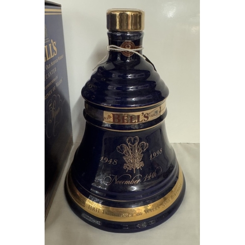 670 - A boxed Bells extra special old Scotch whiskey decanter 'The Prince of Wales 50th birthday'