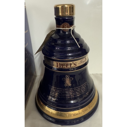 670 - A boxed Bells extra special old Scotch whiskey decanter 'The Prince of Wales 50th birthday'