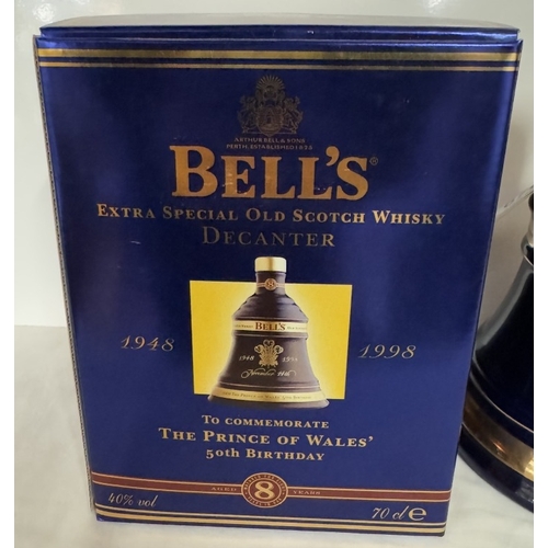 670 - A boxed Bells extra special old Scotch whiskey decanter 'The Prince of Wales 50th birthday'