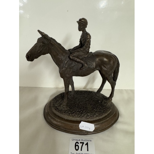 671 - A bronze racehorse with jockey