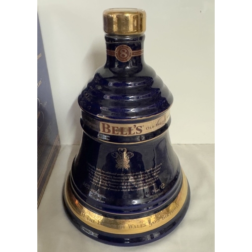 675 - A boxed Bells extra special old Scotch whiskey decanter 'The Prince of Wales 50th birthday' (This bo... 