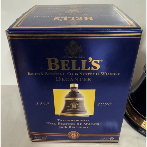 675 - A boxed Bells extra special old Scotch whiskey decanter 'The Prince of Wales 50th birthday' (This bo... 