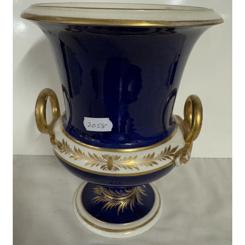 677 - A Derby cobalt ground vase of campana form with gilt snake handles, painted with a traveller in a wo... 